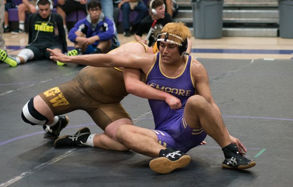 Lemoore's wrestler Jose Lara wrestles as LHS won the West Yosemite League championship and will send 14 Tigers to the Yosemite Division Championships next Friday in Bakersfield.
